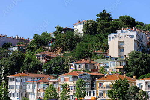 Southern cityscape, view of buildings and houses with green plants in public places in Turkey, sunny summer day in the city of Istanbul