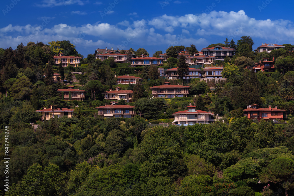 Southern cityscape, view of buildings and houses with green plants in public places in Turkey, sunny summer day in the city of Istanbul Southern cityscape, view of buildings and houses with green plants in public places in Turkey, sunny summer day in the city of Istanbul