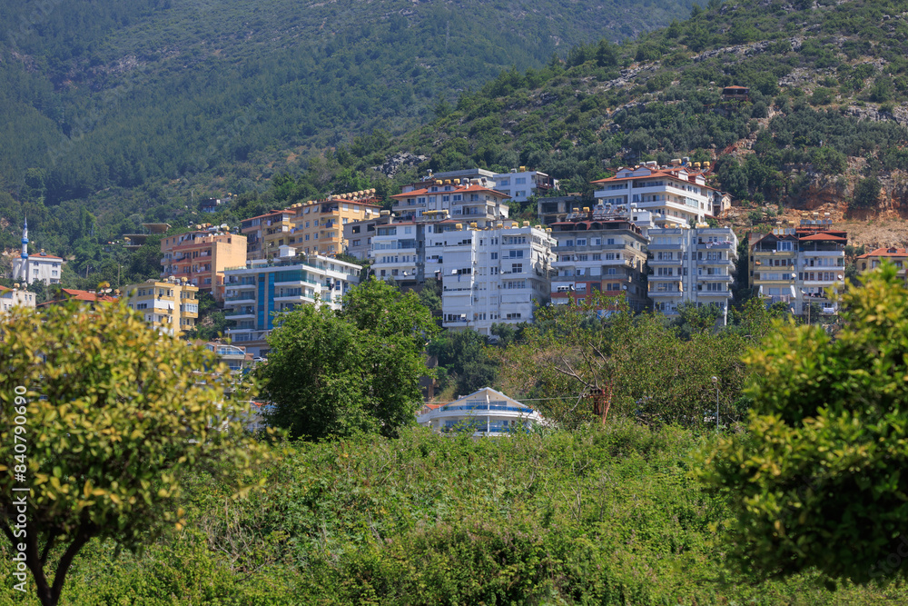 Southern cityscape, view of buildings and houses with green plants in public places in Turkey, sunny summer day in the city of Istanbul Southern cityscape, view of buildings and houses with green plants in public places in Turkey, sunny summer day in the city of Istanbul
