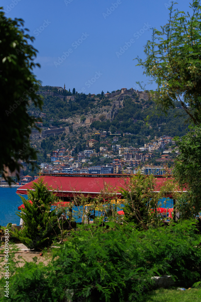 Southern cityscape, view of buildings and houses with green plants in public places in Turkey, sunny summer day in the city of Istanbul Southern cityscape, view of buildings and houses with green plants in public places in Turkey, sunny summer day in the city of Istanbul