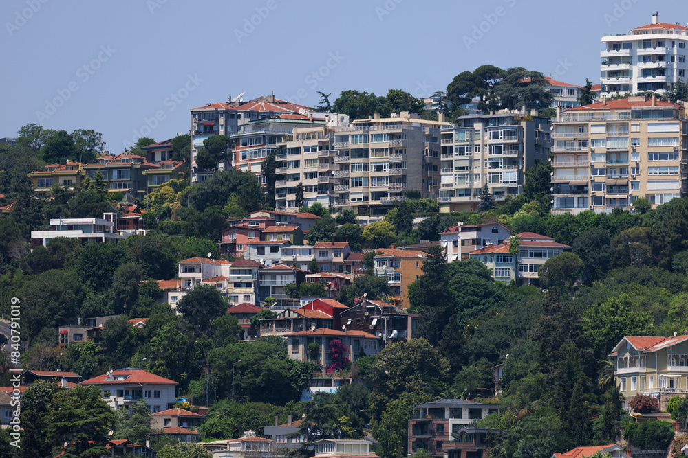 Fototapeta premium Cityscape, view of buildings and houses with green plants in public places in Turkey, sunny summer day in the city of Istanbul