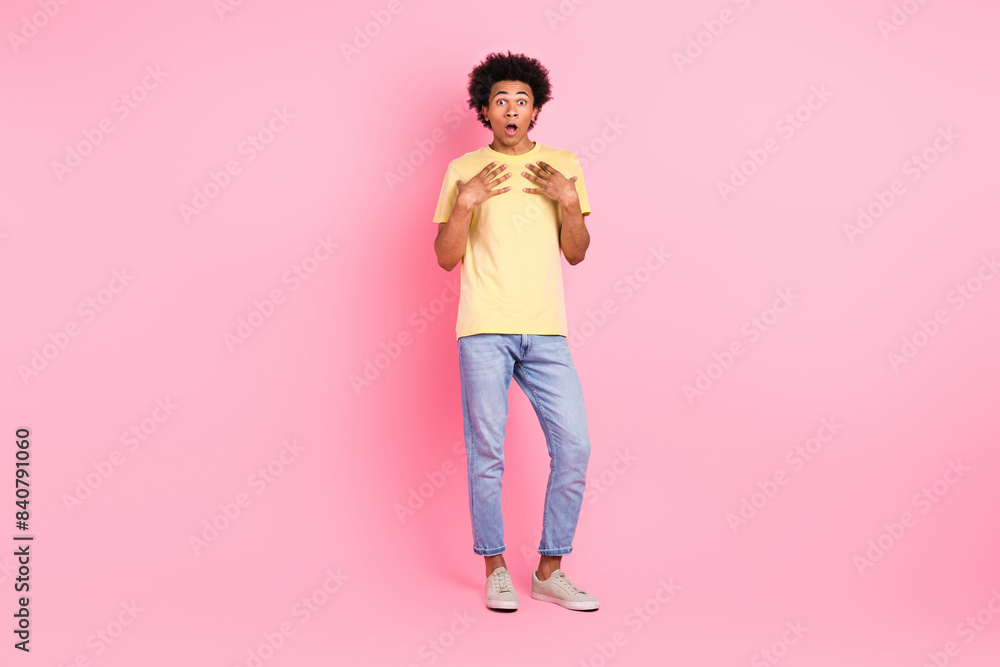 Full size portrait of shocked speechless young person arms touch chest cant believe isolated on pink color background Full size portrait of shocked speechless young person arms touch chest cant believe isolated on pink color background