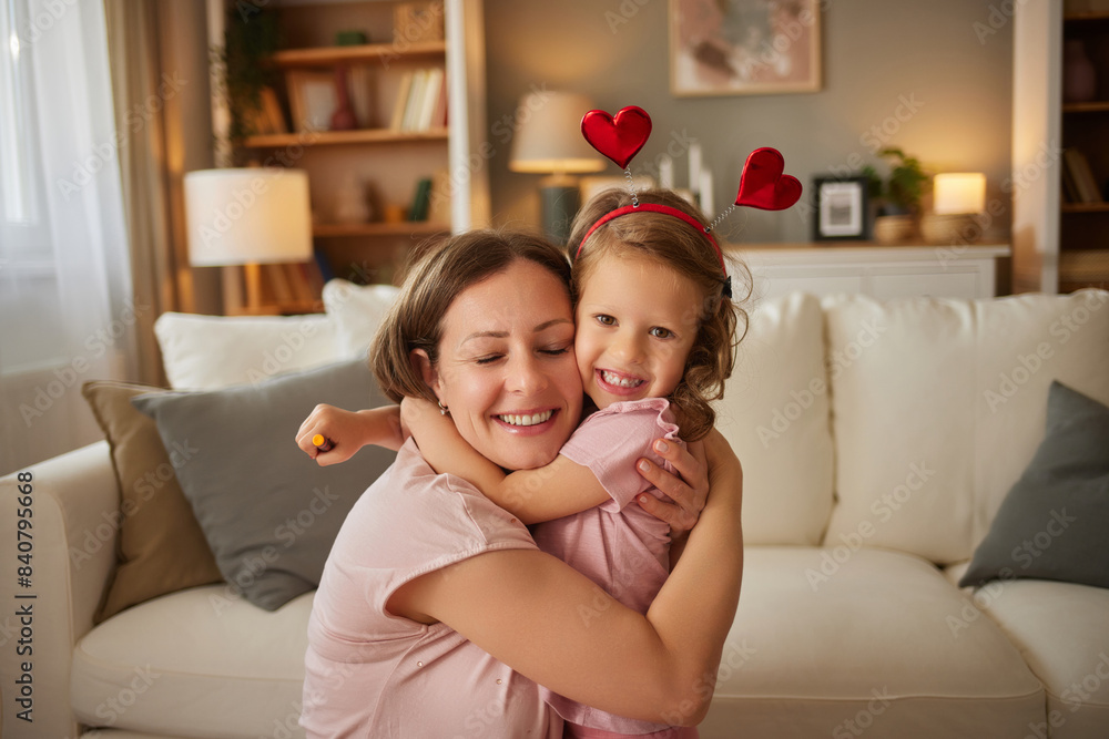 Happy mom and small daughter enjoy tender moment at home Happy mom and small daughter enjoy tender moment at home