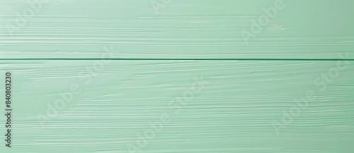 Background image featuring light green painted wood grain with a glass pane going horizontally across the center, creating a modern and minimalist aesthetic