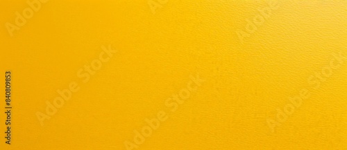 Bright yellow textured background is providing a clean and minimal look. This solid color background would be perfect for a variety of projects photo