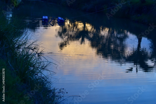 Pond reflects the image of the evening sky