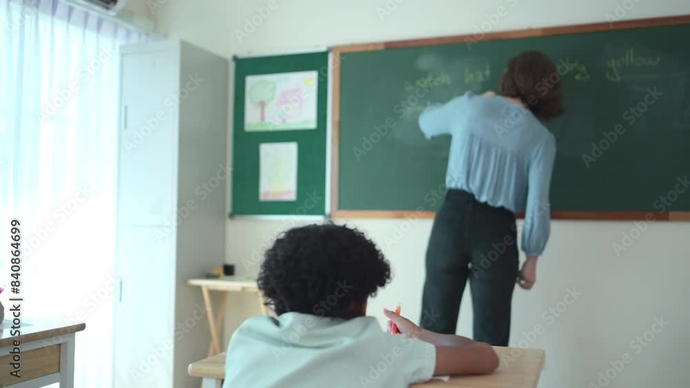 Teacher and students, Learn and study in a classroom of school where youngsters sit and listen attentively. Teacher and students, Learn and study in a classroom of school where youngsters sit and listen attentively.