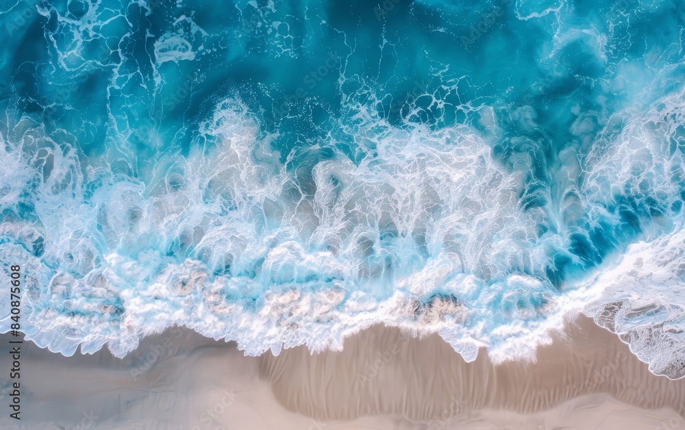 Aerial view of ocean waves hitting the beach Aerial view of ocean waves hitting the beach