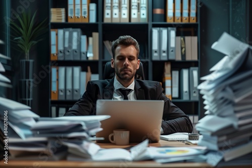 Businessman Working Late with Stacks of Papers