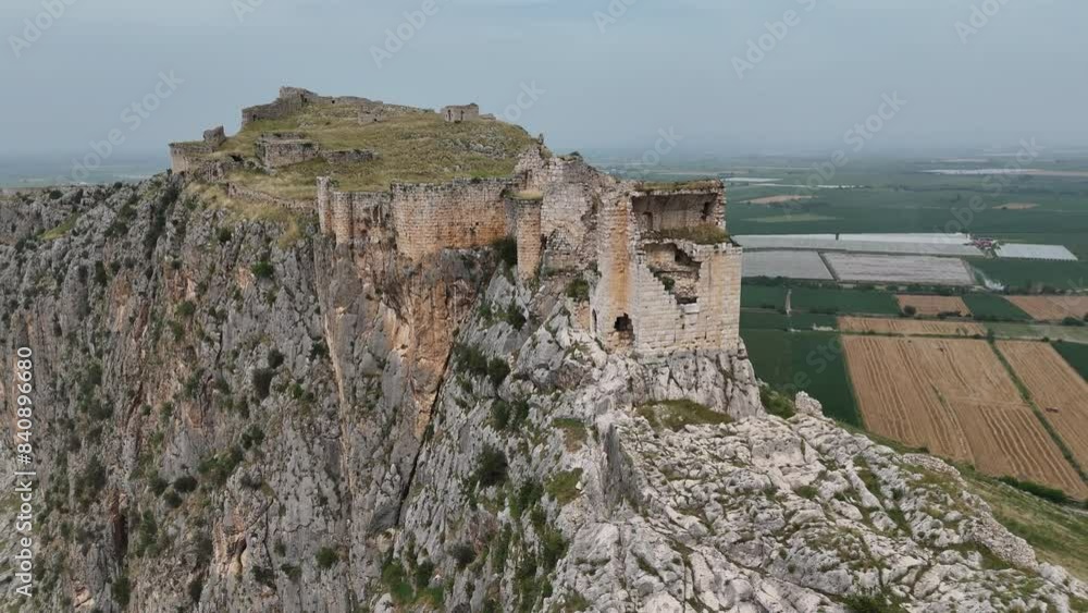 A drone captures stunning views of Anavarza Castle, a historic fortress perched on a mountaintop in Adana, Turkey. Discover the intricate architecture and marvel at the ancient engineering feats A drone captures stunning views of Anavarza Castle, a historic fortress perched on a mountaintop in Adana, Turkey. Discover the intricate architecture and marvel at the ancient engineering feats