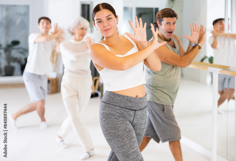 Fototapeta premium Active sports people learning how to dance modern dances in a dance studio