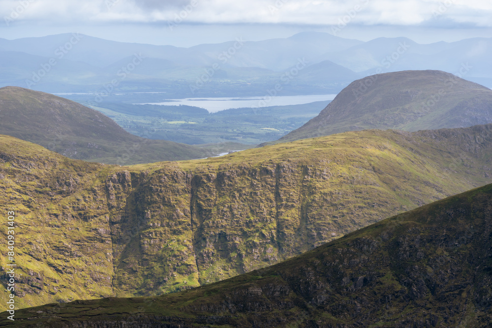 Panoramic view from Devils Ladder, one of most difficult trails, that is leading to highest Irish mountain Carrauntoohill or Carrantuohill is the highest mountain in Ireland at 1038m in Ring of Kerry Panoramic view from Devils Ladder, one of most difficult trails, that is leading to highest Irish mountain Carrauntoohill or Carrantuohill is the highest mountain in Ireland at 1038m in Ring of Kerry