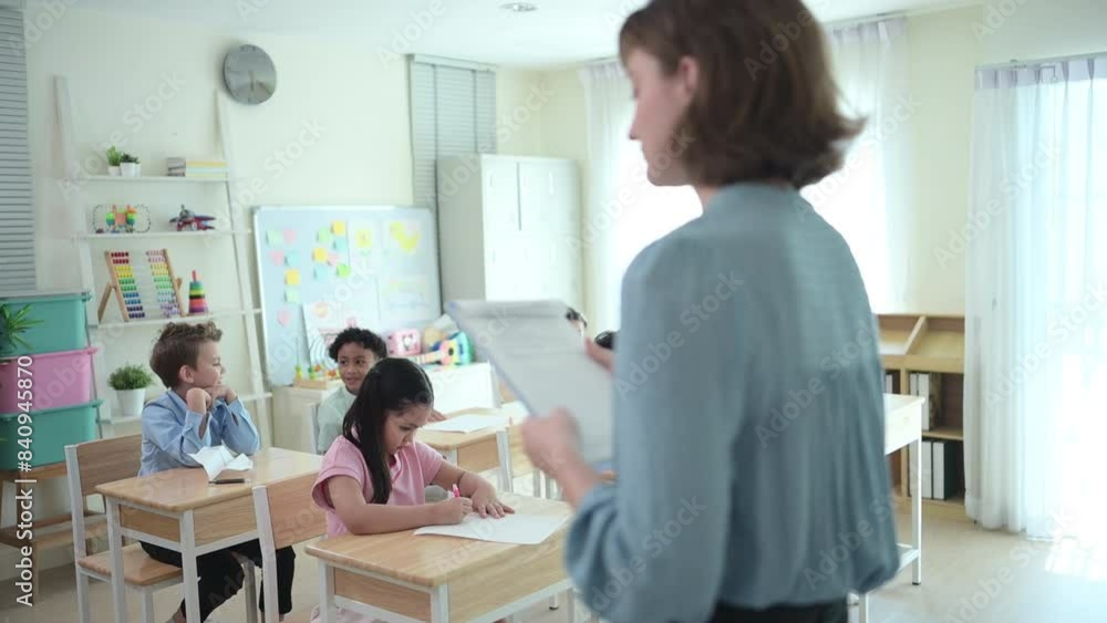 Teacher and students, Learn and study in a classroom of school where youngsters sit and listen attentively. Teacher and students, Learn and study in a classroom of school where youngsters sit and listen attentively.