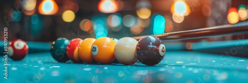 Neon lit billiard table with cue and pool balls under vibrant neon light ambiance