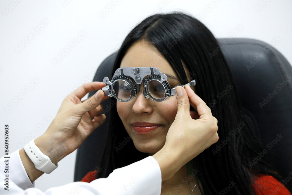 Patient at an Eye Check-Up using optical equipment Patient at an Eye Check-Up using optical equipment