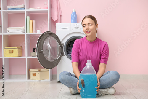 Young woman with bottle of ...