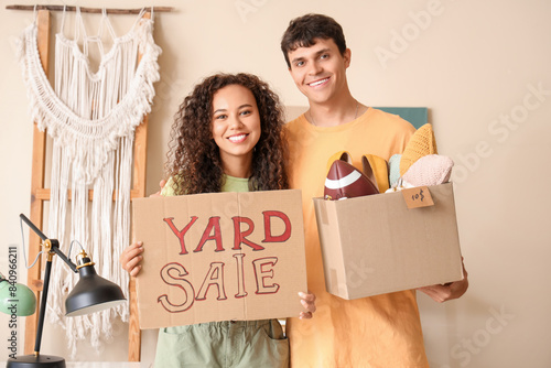 Young couple holding cardbo...