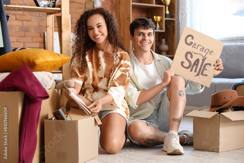 Young couple holding cardbo...
