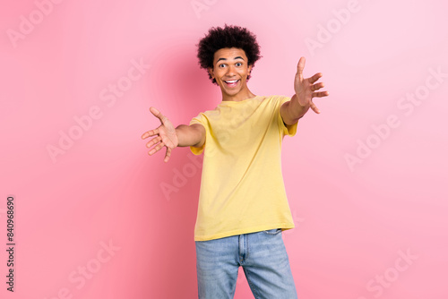 Photo of positive cheerful person raise opened arms welcome invite you isolated on pink color background © deagreez