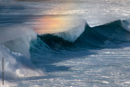 Canvas Print Majestic waves crashing along the coastline of Sydney, Australia, with a vibrant rainbow effect in the mist
