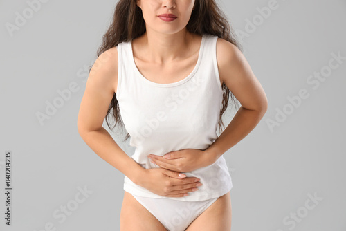 Young woman in underwear su...