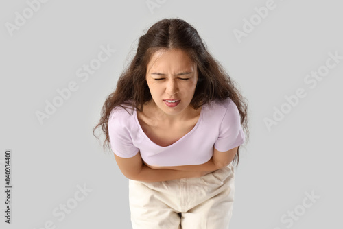 Young Asian woman suffering...