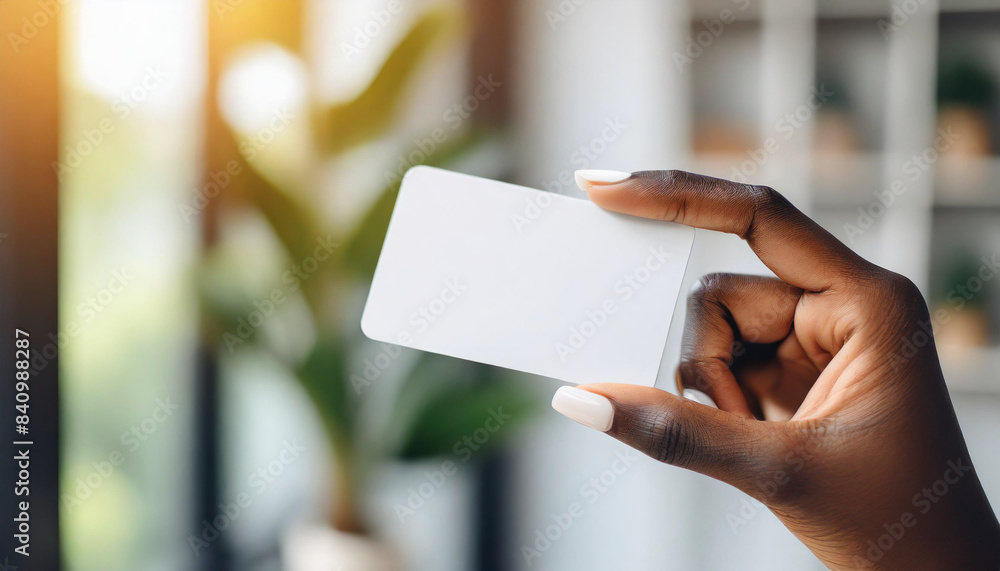 Woman's hand holding white business card, isolated on white background. Concept of professional networking and communication Woman's hand holding white business card, isolated on white background. Concept of professional networking and communication