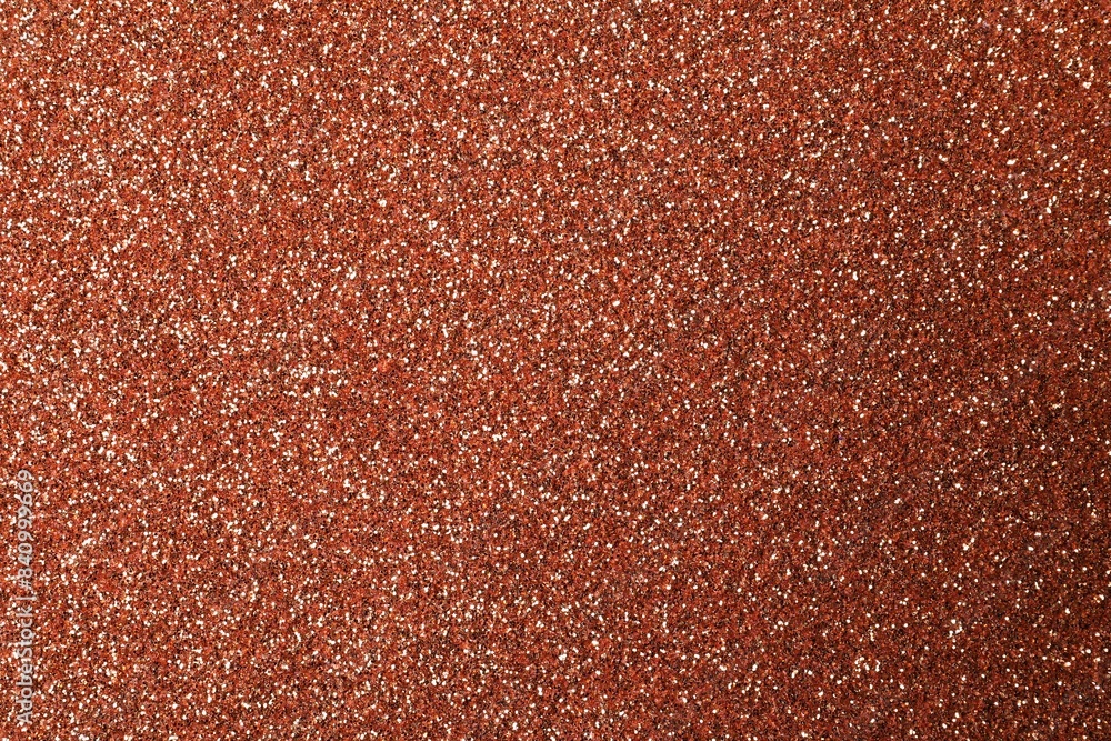 Fototapeta premium Beautiful shiny copper glitter as background, closeup