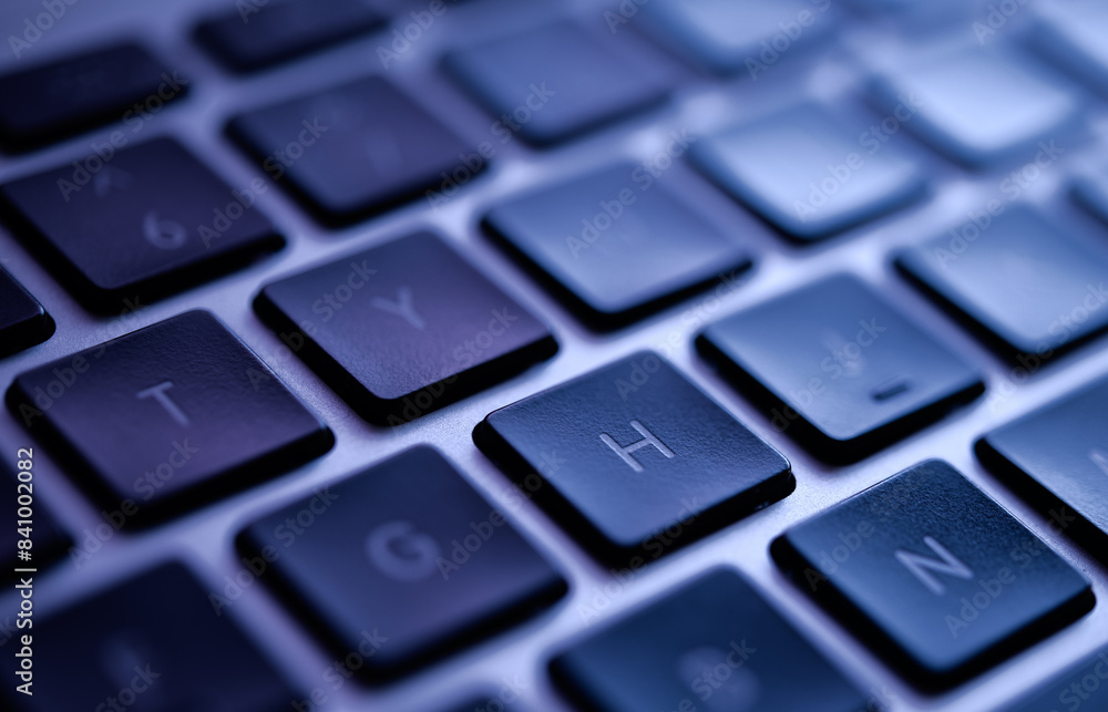 Close-Up of Modern Laptop Keyboard in Blue Tones Highlighting Technology and Design Close-Up of Modern Laptop Keyboard in Blue Tones Highlighting Technology and Design