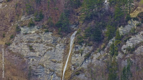 Waterfall in the mountains. Dundelbachfall waterfall near lake Lungernsee. Canton Obwalden, Switzerland photo