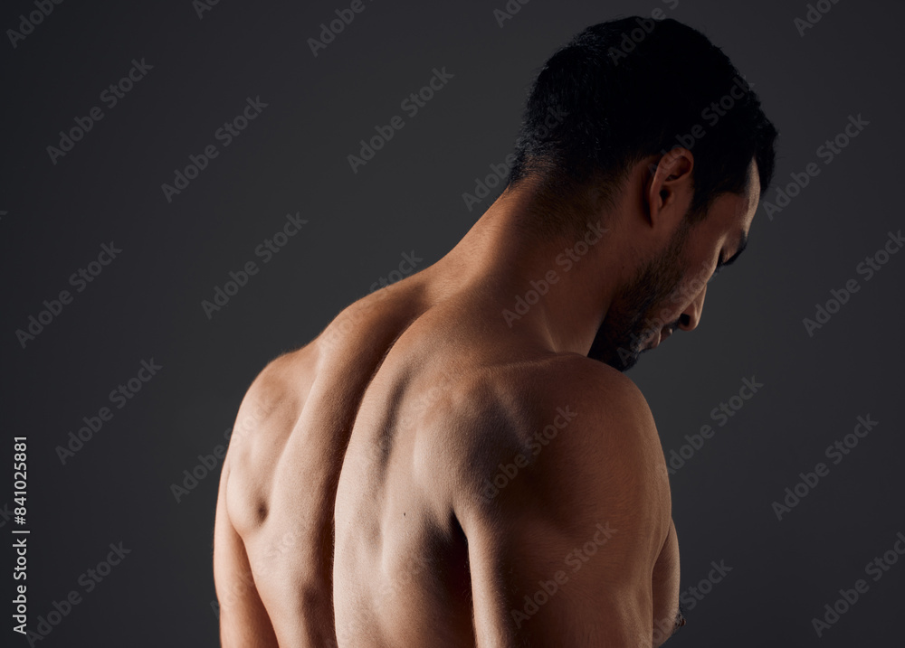 Sexy, muscle and back of man for exercise with workout, gym aesthetic and results for fitness goals in studio. Topless guy, bodybuilder and strong body with shoulder training by black background Sexy, muscle and back of man for exercise with workout, gym aesthetic and results for fitness goals in studio. Topless guy, bodybuilder and strong body with shoulder training by black background
