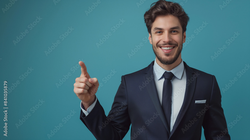 Young caucasian male businessman in suit point finger at the right, standing on blue background with copy space Young caucasian male businessman in suit point finger at the right, standing on blue background with copy space