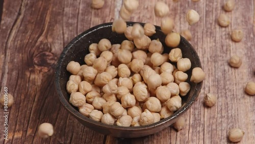 Slow motion of Falling chickpeas to a Rustic Kitchen Setting