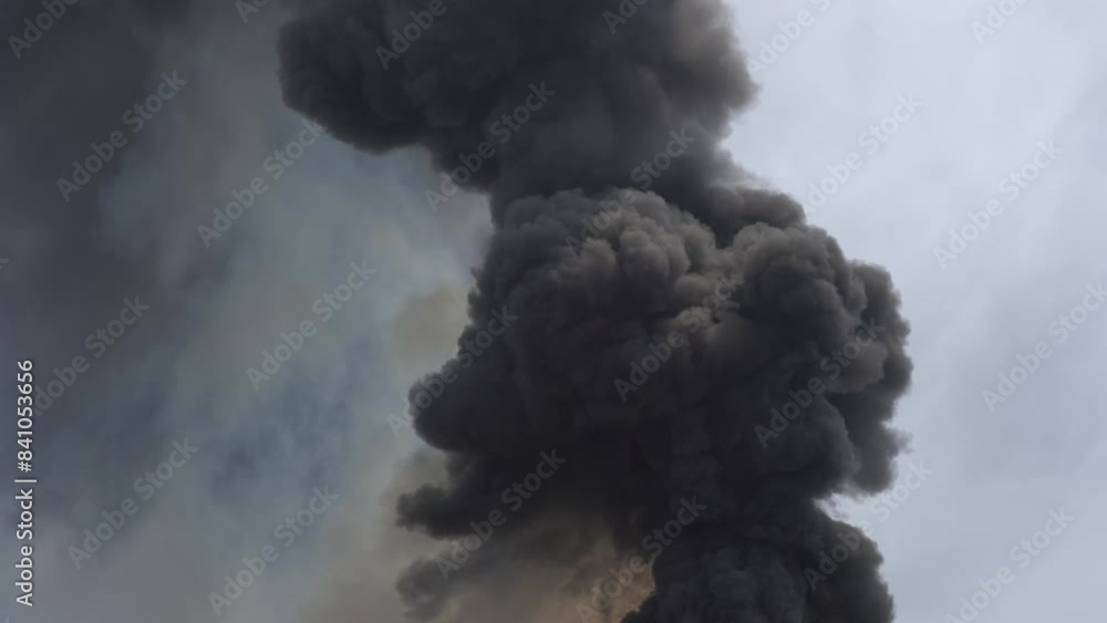 Black smoke caused by burning plastic from cause of fire industrial plant Black smoke caused by burning plastic from cause of fire industrial plant