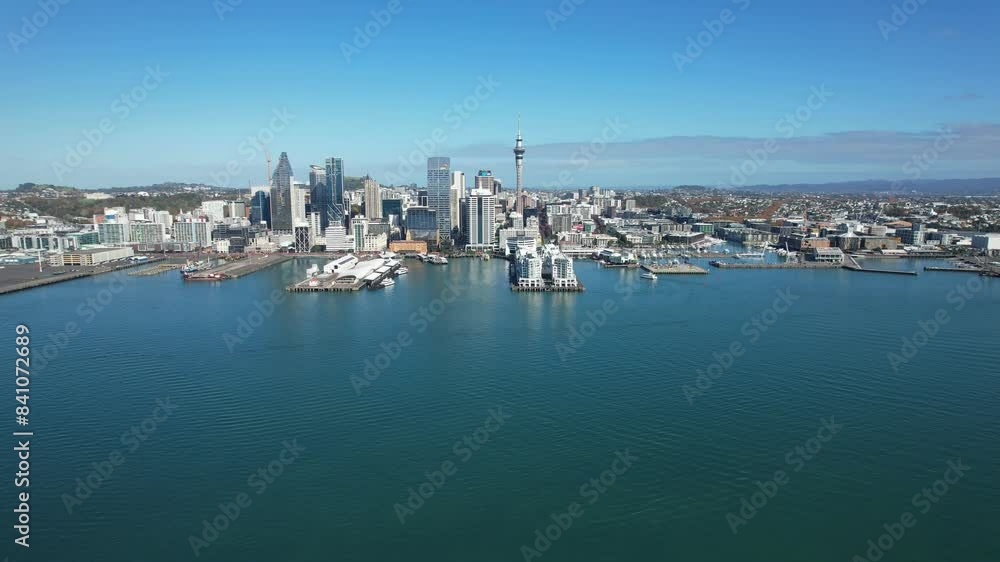 Auckland Harbour And City Centre In Auckland, North Island, New Zealand. Ferry Boat Sailing In Foreground. wide shot Auckland Harbour And City Centre In Auckland, North Island, New Zealand. Ferry Boat Sailing In Foreground. wide shot
