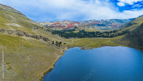 Aerial view of Laguna Hualcupén between a valley