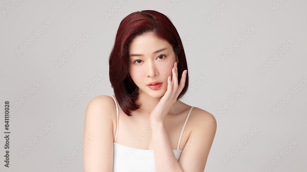 Beautiful young asian woman with clean fresh skin on grey background, Face care, Facial treatment, Cosmetology, beauty and spa, Asian women portrait. Beautiful young asian woman with clean fresh skin on grey background, Face care, Facial treatment, Cosmetology, beauty and spa, Asian women portrait.