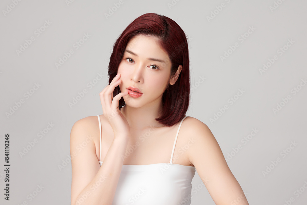 Beautiful young asian woman with clean fresh skin on grey background, Face care, Facial treatment, Cosmetology, beauty and spa, Asian women portrait. Beautiful young asian woman with clean fresh skin on grey background, Face care, Facial treatment, Cosmetology, beauty and spa, Asian women portrait.