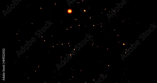 Realistic surreal ember fire dust slowing rising up on black bg 4K. Grunge dark fire sparks flying isolated on dark background. Overlay spark tiny flake burning animation. Hell rising burst inferno.