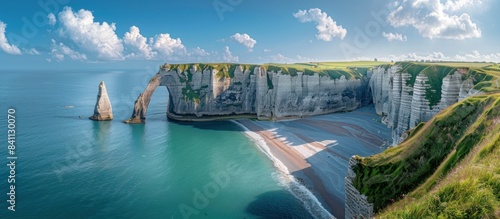 panoramic view of the white cliffs and blue sea at Etretat in France, sunny day, beautiful sky. photo