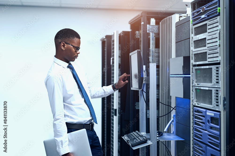 Data center, engineer and black man with pc in server room for information technology, maintenance or software update. Cyber, code and technician for troubleshooting, configuration or system recovery Data center, engineer and black man with pc in server room for information technology, maintenance or software update. Cyber, code and technician for troubleshooting, configuration or system recovery