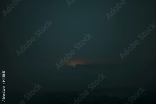 Single Light in Foggy Dark Sky - Aerial View