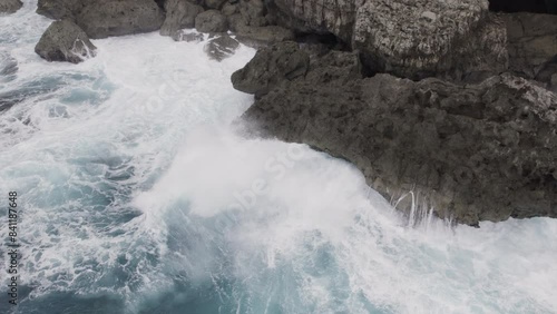 Aerial Slow Motion Waves Crashing Against Rocks - Hinnamnor photo