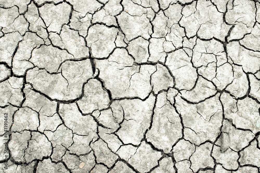 Dry cracked earth texture. Drought. Soil erosion. Abstract background. Global Warming. Climate Change. Crack soil in the dry season. Dry and broken soil background. Bad environment concept Dry cracked earth texture. Drought. Soil erosion. Abstract background. Global Warming. Climate Change. Crack soil in the dry season. Dry and broken soil background. Bad environment concept