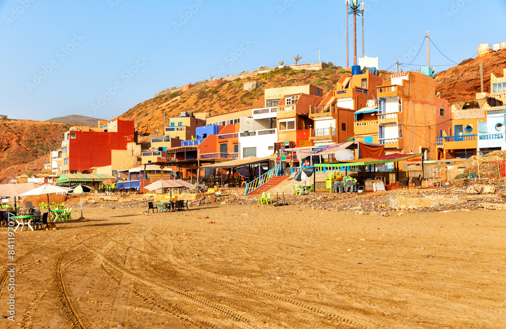 Panorama view of the red cliffs and Legzira village on the Atlantic Coast of Morocco Panorama view of the red cliffs and Legzira village on the Atlantic Coast of Morocco
