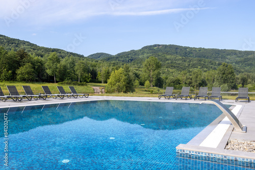 Outdoor hotel swimming pool in the summer