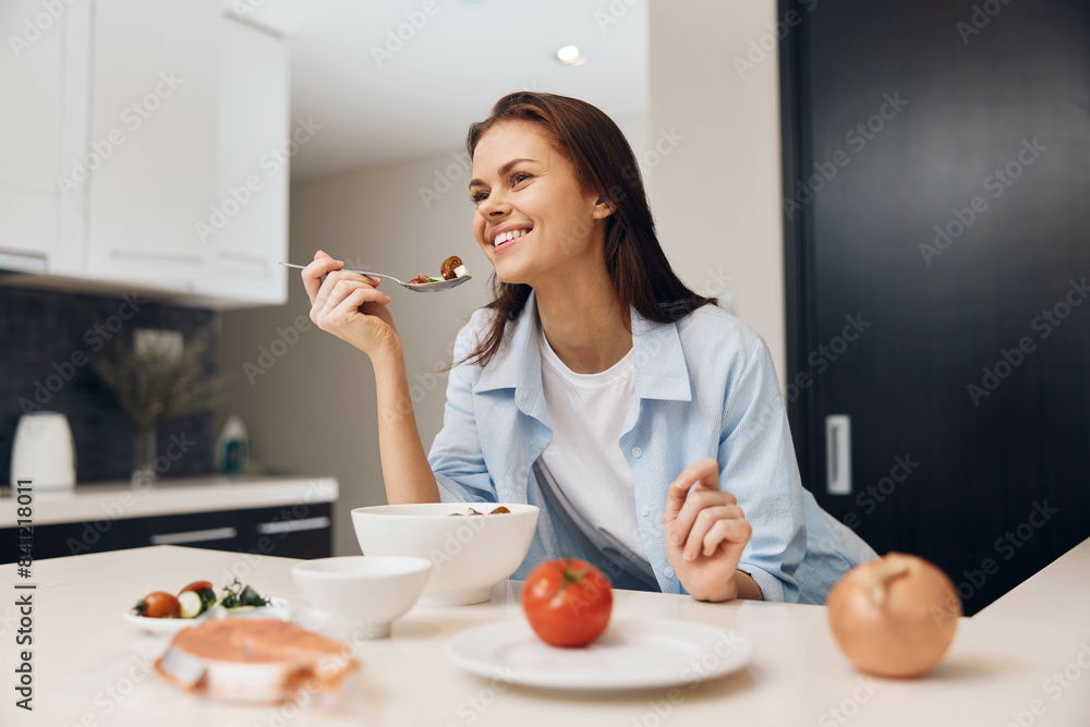 Woman sitting at kitchen table with bowl of food in front of her, ready to eat healthy meal Woman sitting at kitchen table with bowl of food in front of her, ready to eat healthy meal
