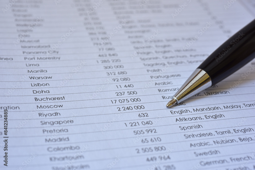 Luxury pen close up shot on spreadsheet table list, blurred background Luxury pen close up shot on spreadsheet table list, blurred background