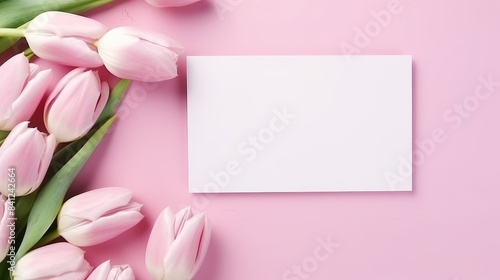 Empty frame copy space for your text or design with beautiful pink tulip bouquet on pink background. Template mock up for holiday greeting card.