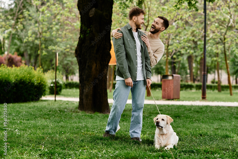 Two bearded gay men in casual attire walk their labrador dog through a green park, enjoying a sunny afternoon. Two bearded gay men in casual attire walk their labrador dog through a green park, enjoying a sunny afternoon.